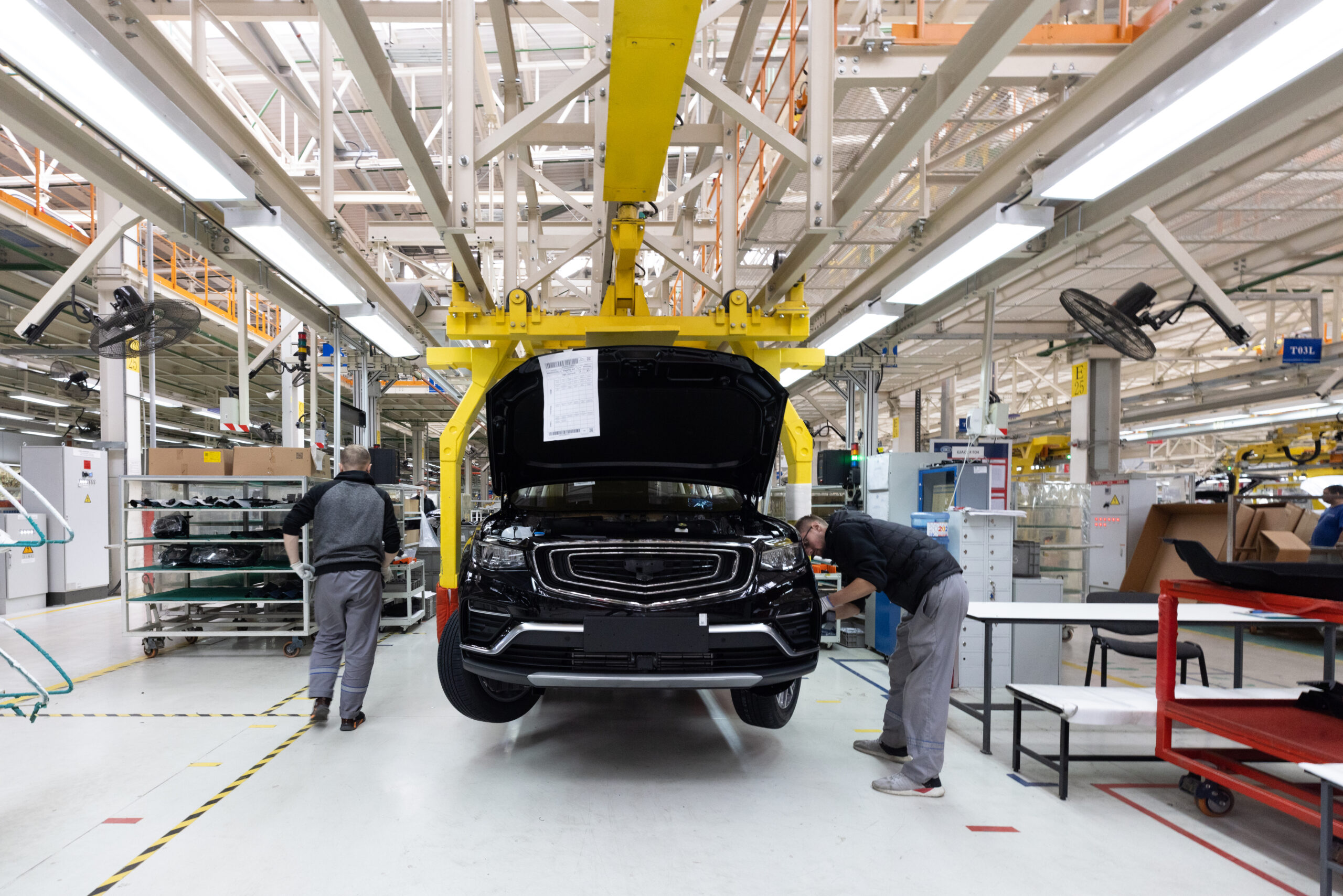 minsk, belarus dec 15, 2021: automobile production line. welding car body. modern car assembly plant. auto industry. interior of a high tech factory, modern production